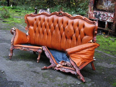 Company service vehicle at a skip delivery site