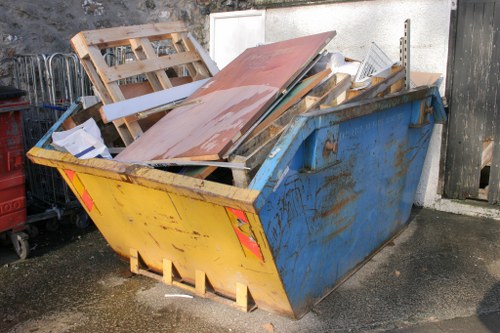 City workers placing a skip with a permit in Edmonton