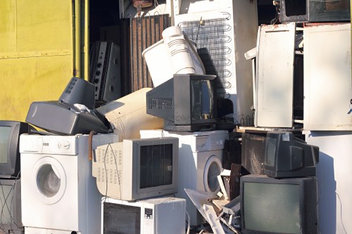 People loading household waste into a rented skip in Edmonton